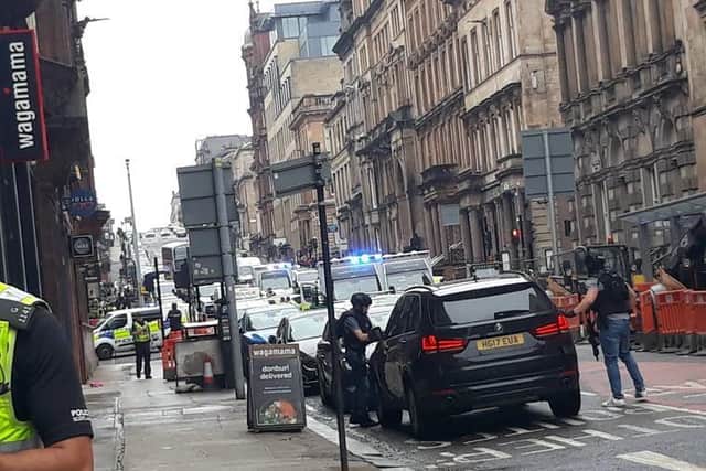 Photo taken with permission from the Twitter feed of @ThatReilz of police presence in West George Street, Glasgow, as a serious police incident has closed roads in the city centre. Credit: PA PICTURE DESK