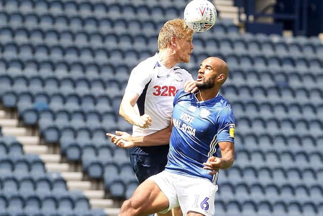 PNE striker Jayden Stockley challenges in the air with cardiff defender Curtis Nelson