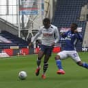 Preston North End right-back Darnell Fisher goes past Cardiff's Junior Hoilett at Deepdale