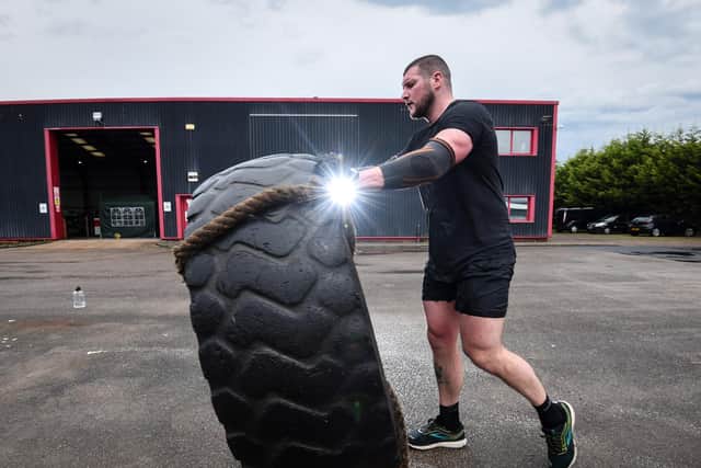 Bill Hodgson with the 28 stone tyre during his gruelling challenge