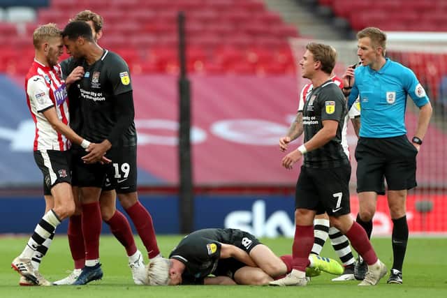 The flash point in the League Two play-off final which led to referee Michael Salisbury sending-off Exeter's Dean Moxey
