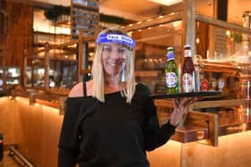 Staff like Laura Short will be greeting customers in PPE.