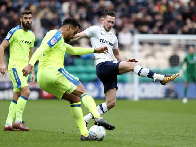 Tom Huddlestone in action against Alan Browne at Deepdale.