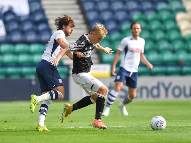 Preston midfielder Ben Pearson pursues Derby's Louie Sibley at Deepdale