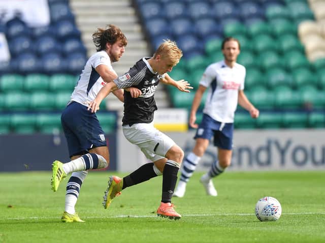 Preston midfielder Ben Pearson pursues Derby's Louie Sibley at Deepdale