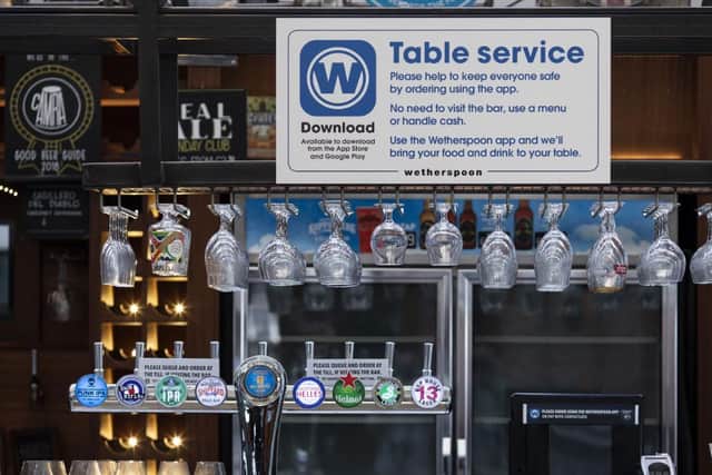 Some pubs, including branches of Wetherspoons, will be encouraging customers to use its table service. Photo by Dan Kitwood/Getty Images
