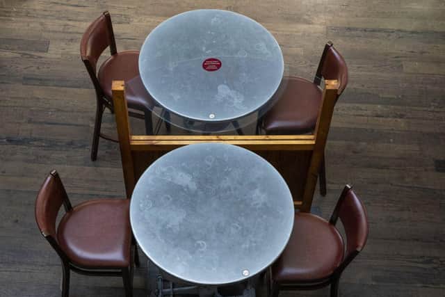 Plastic screens have been installed between tables at some branches of Weatherspoons. It plans to open 750 of its UK pubs this weekend. Photo by Dan Kitwood/Getty Images
