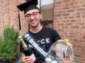 Jack celebrating his achievements at home during the pandemic.