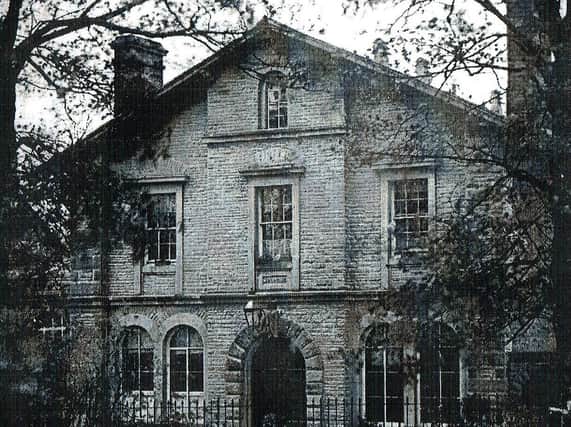An early photograph of Victoria Hall in Settle (year unknown). Note the chimneys, ground -floor windows in place of the modern doors and the datestone over the door.