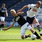 Paul Huntington challenges Derby striker Louie Sibley in Wednesday’s clash at Deepdale
