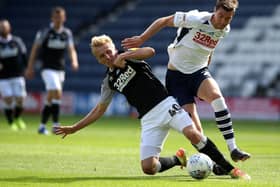 Paul Huntington challenges Derby striker Louie Sibley in Wednesday’s clash at Deepdale