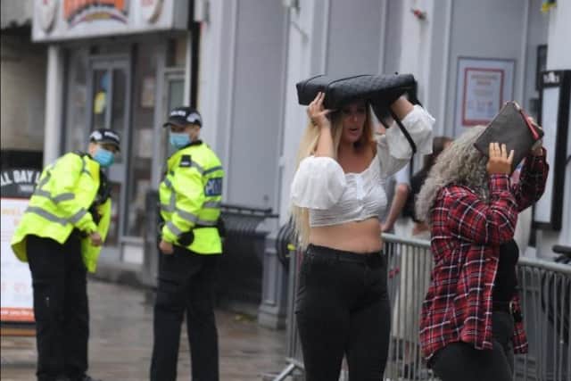 Trying to stay dry on a rainy Super Saturday in Preston.