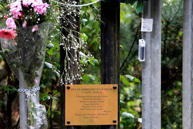 Floral tributes at the entrance to the quarry