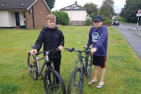 Elliot and Rory gearing up for 65-mile bike ride to Old Trafford.