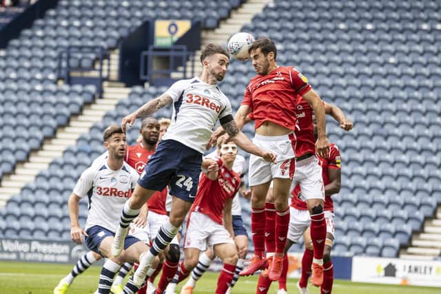 PNE striker Sean Maguire jumps with Nottingham Forest;s Yuri Ribeiro at Deepdale