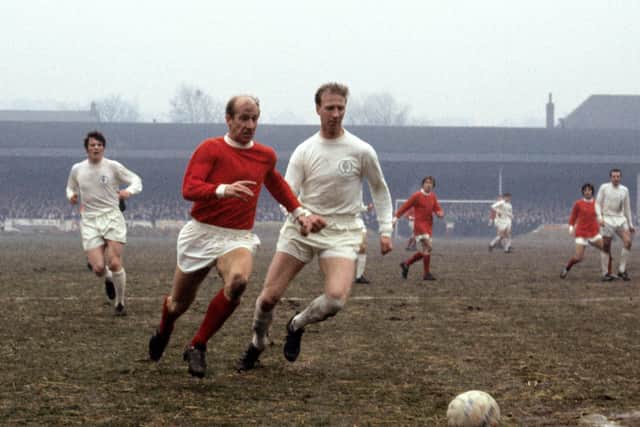 File photo dated 11-01-1969 of Manchester United's Bobby Charlton (left) takes on Leeds United's Jack Charlton.