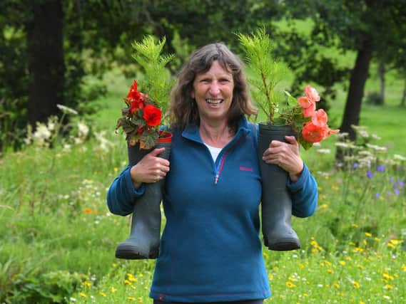 Maureen Priestley of Chipping in Bloom with her flower filled wellington boots (Photo: Neil Cross)
