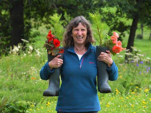 Maureen Priestley of Chipping in Bloom with her flower filled wellington boots (Photo: Neil Cross)