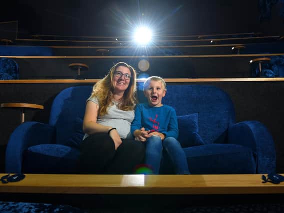 Amanda and Toby Rafferty, seven, get a sneak preview of the re-opened cinema at The Flower Bowl  at Barton Grange Garden Centre  Photo: Neil Cross