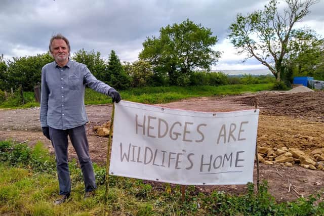 A Longridge Environment Group protestor at the development site