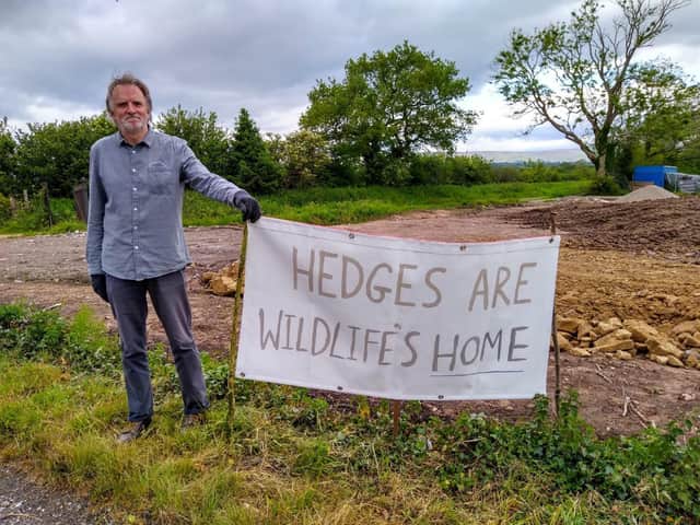 A Longridge Environment Group protestor at the development site
