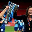 Ainsworth with the League One play-off final trophy at Wembley on Monday night
