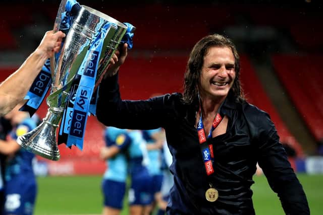 Ainsworth with the League One play-off final trophy at Wembley on Monday night