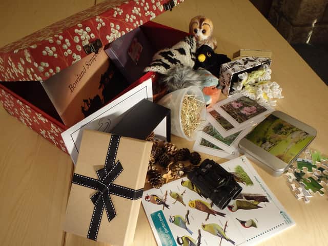 Creating a memory box. This box contains a range of resources which will evoke memories of visits to the Bowland AONB (Area of Outstanding Natural Beauty).