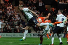 Tom Clarke heads PNE's winner against Blackpool in August 2013