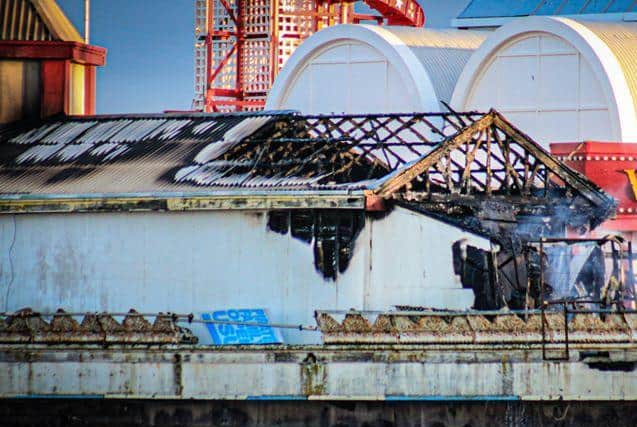 A workshop on Blackpool's Central Pier on Friday morning (July 17) after being severely damaged by fire. Photo: Gordon Head