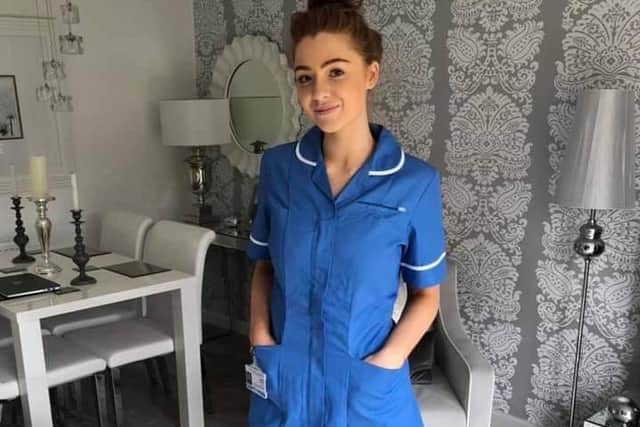 Amelia in her nursing uniform.