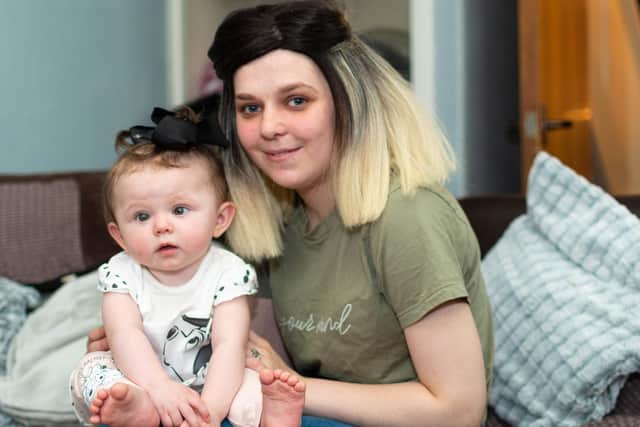 Romany Hopkins, who has meningitis, with her mum Demi Bamber on her first birthday.