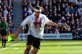 Gareth Ainsworth, his shirt splattered in blood, in action for Preston against Coventry in April 2002 at Deepdale