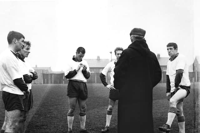 Alex Dawson (right) with team-mates Brian Godfrey, Alan Spavin and Alec Ashworth being spoken to by Preston manager Jimmy Milne