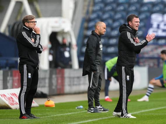 Caretaker boss Steve Spooner (left) alongside Alex Neil (centre) and fellow caretaker boss Craig Gardner (right) on the Deepdale touchline.