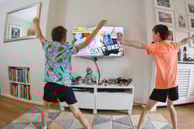 Ben and Isaac Rickett take part in the last session of PE with Joe, the online fitness workout by fitness coach Joe Wicks, at their home