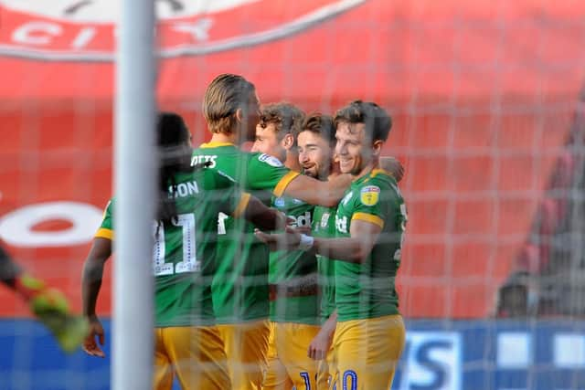 Sean Maguire is congratulated after scoring for Preston