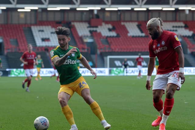 Preston striker Sean Maguire takes on Bristol City's Ashley Williams