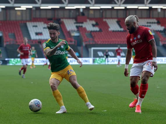 Preston striker Sean Maguire takes on Bristol City's Ashley Williams