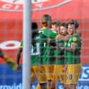 The Preston players celebrate Sean Maguire's opener.