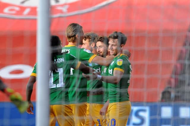 The Preston players celebrate Sean Maguire's opener.