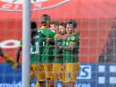 The Preston players celebrate Sean Maguire's opener.