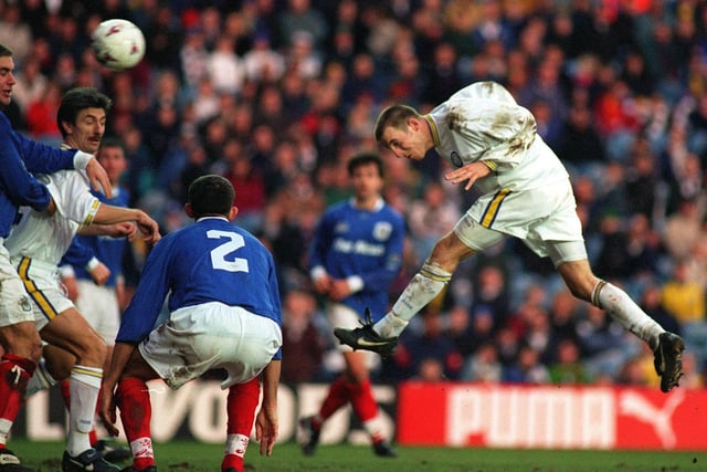 Lee Bowyer heads home his second goal against Pompey in an FA Cup clash at Elland Road.