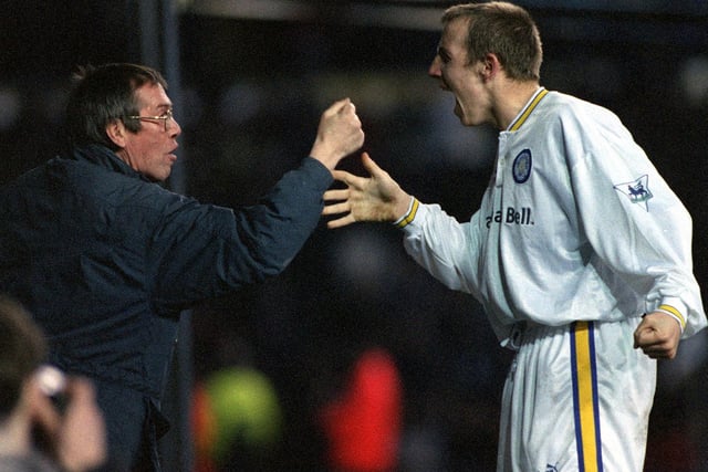 Lee Bowyer celebrates with a Leeds United fan after scoring in a 4-0 win against Blackburn Rovers at Elland Road.