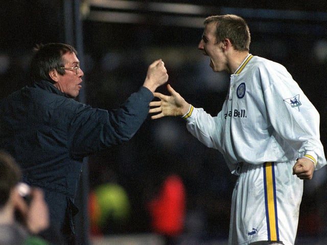 Lee Bowyer celebrates with a Leeds United fan after scoring in a 4-0 win against Blackburn Rovers at Elland Road.