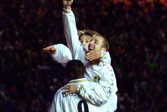 Lee Bowyer celebrates with Alan Smith and Jimmy Floyd Hasselbaink after scoring against Coventry City at Elland Road.
