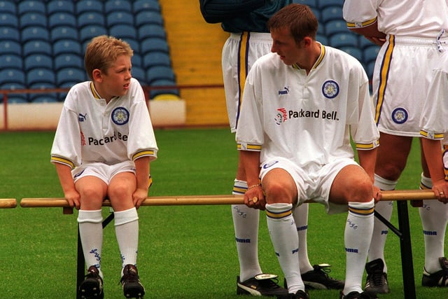 Footballers just keep getting younger. Lee Bowyer chats to Howard Wilkinson's son Ben at an Elland Road photocall.