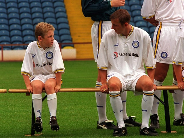 Footballers just keep getting younger. Lee Bowyer chats to Howard Wilkinson's son Ben at an Elland Road photocall.
