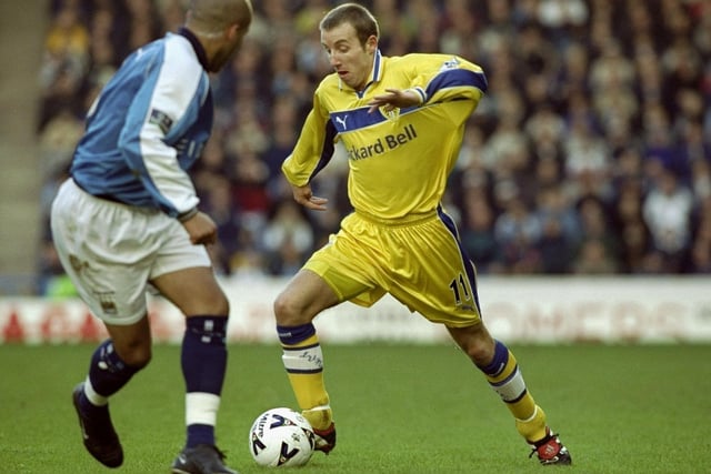 Lee Bowyer takes on Richard Edgehill of Manchester City during the FA Cup fourth round clash at Maine Road. Leeds won 5-2.