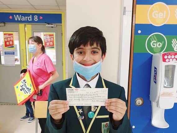 Ahaan pictured with the bumper cheque he presented to the hospital